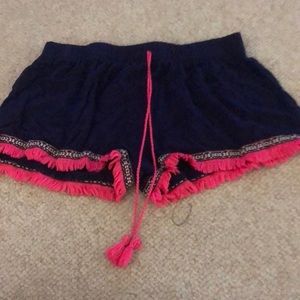 Blue and pink shorts with ruffles on the bottom